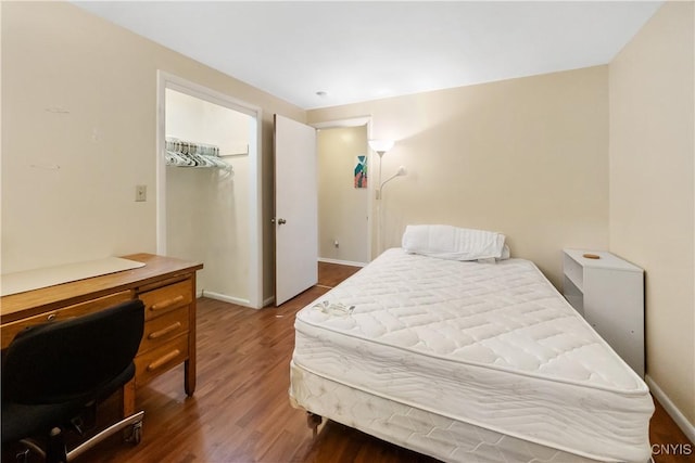 1018-20 Ackerman Ave, Syracuse, NY 13210 - bedroom featuring wood finished floors, a desk, and a spacious closet