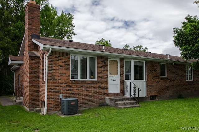 573 Locust St, North Tonawanda, NY 14120 - single story home featuring a front yard, brick siding, and a chimney