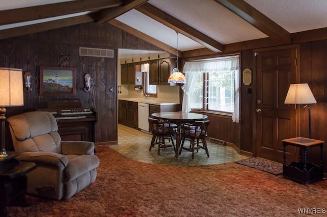573 Locust St, North Tonawanda, NY 14120 - dining area featuring wooden walls and carpet floors