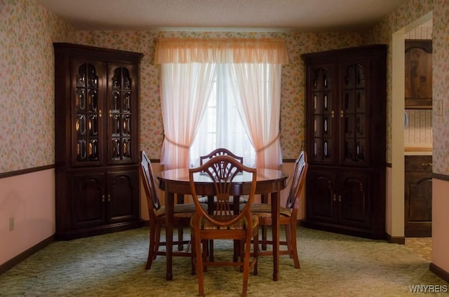 573 Locust St, North Tonawanda, NY 14120 - dining room with wallpapered walls and light carpet