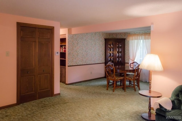 573 Locust St, North Tonawanda, NY 14120 - carpeted dining space featuring baseboards
