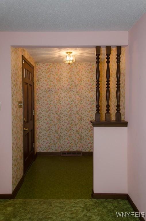 573 Locust St, North Tonawanda, NY 14120 - hall with carpet, wallpapered walls, and a textured ceiling