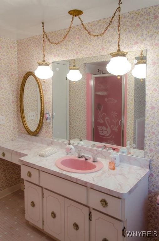 573 Locust St, North Tonawanda, NY 14120 - bathroom with wallpapered walls, vanity, tile patterned floors, and a stall shower