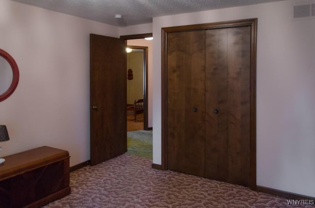 573 Locust St, North Tonawanda, NY 14120 - bedroom with carpet flooring, a closet, and a textured ceiling