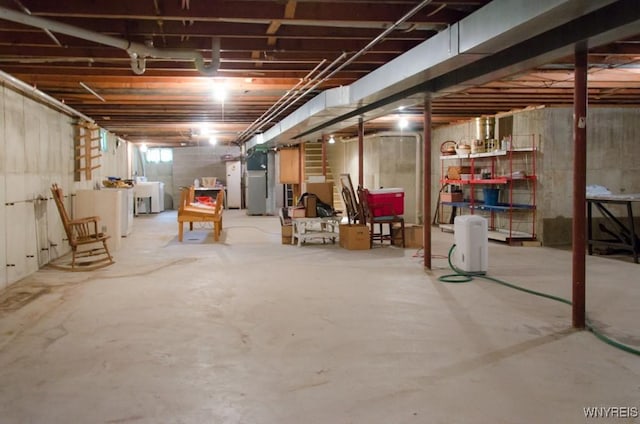573 Locust St, North Tonawanda, NY 14120 - unfinished basement featuring washer / clothes dryer