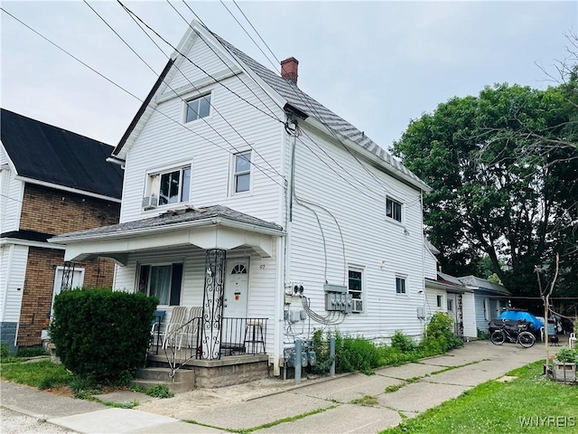 97 Kail St, Buffalo, NY 14207 - view of front of house with covered porch and a chimney