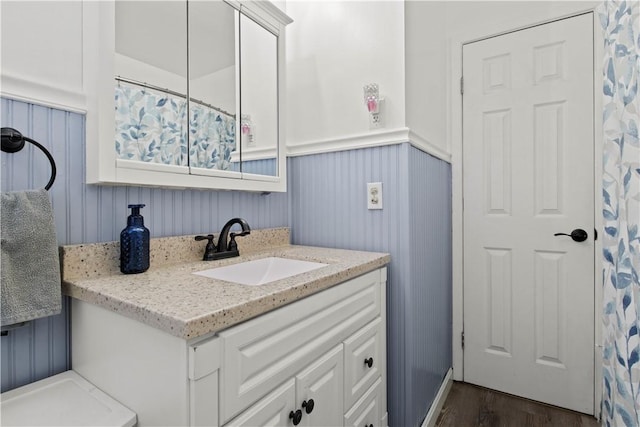 111 Crimson Bramble Rd, Henrietta, NY 14623 - full bathroom featuring vanity, wood finished floors, and a wainscoted wall