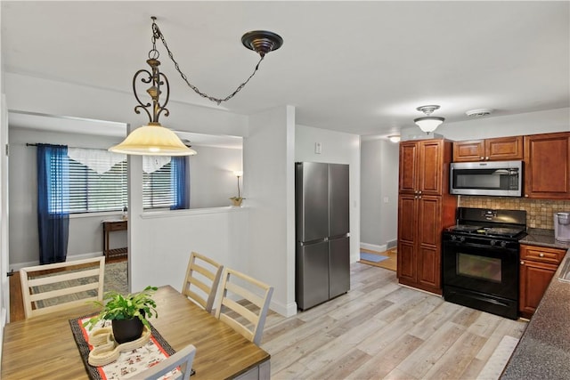 111 Crimson Bramble Rd, Henrietta, NY 14623 - kitchen featuring stainless steel appliances, decorative backsplash, light wood-style flooring, decorative light fixtures, and brown cabinetry