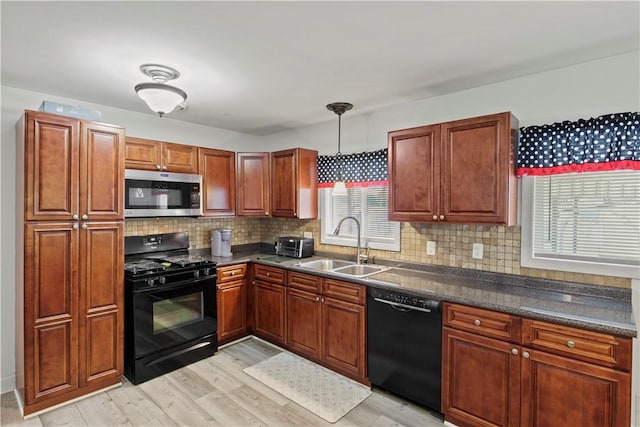 111 Crimson Bramble Rd, Henrietta, NY 14623 - kitchen with black appliances, dark countertops, light wood-type flooring, tasteful backsplash, and healthy amount of natural light