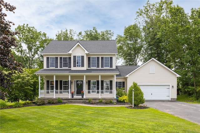 2023 Rainbow Ln, Lima, NY 14485 - colonial house featuring an attached garage, asphalt driveway, covered porch, a front yard, and roof with shingles