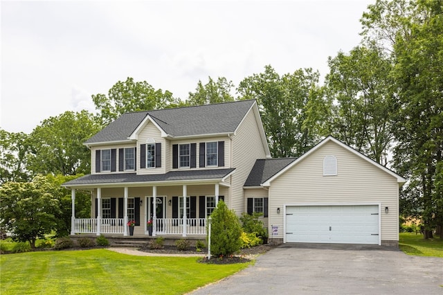 2023 Rainbow Ln, Lima, NY 14485 - colonial home featuring a porch, driveway, a front yard, and a garage
