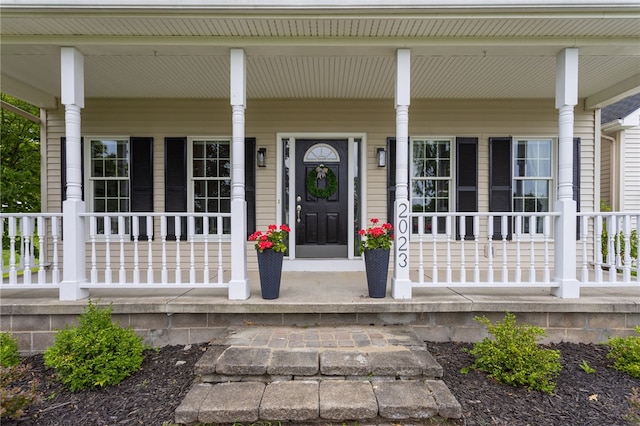 2023 Rainbow Ln, Lima, NY 14485 - view of exterior entry featuring a porch