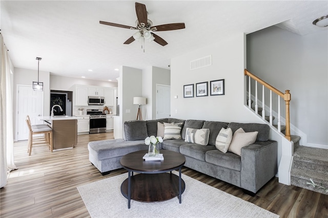2023 Rainbow Ln, Lima, NY 14485 - living area featuring ceiling fan, light wood-style flooring, stairs, and recessed lighting