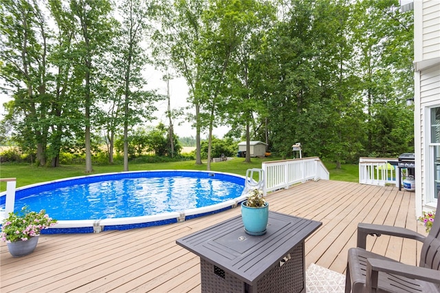 2023 Rainbow Ln, Lima, NY 14485 - outdoor pool with a yard, area for grilling, and a wooden deck