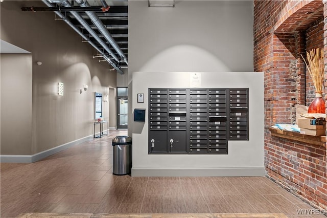 149 Swan St Unit 310, Buffalo, NY 14203 - view of community featuring a towering ceiling, brick wall, and mail area