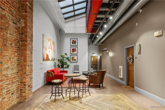 149 Swan St Unit 310, Buffalo, NY 14203 - dining space with baseboards and a towering ceiling