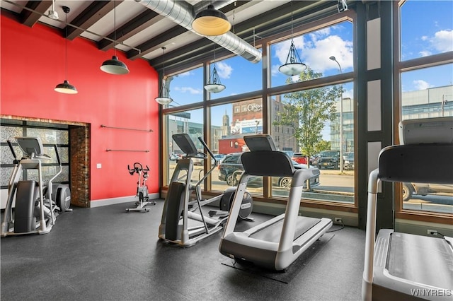 149 Swan St Unit 310, Buffalo, NY 14203 - exercise room featuring a high ceiling and beam ceiling