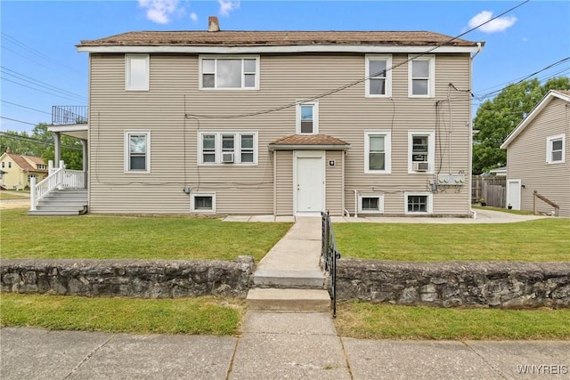 540 Longmeadow Rd, Amherst, NY 14226 - view of front of home featuring a front lawn, a shingled roof, and a chimney
