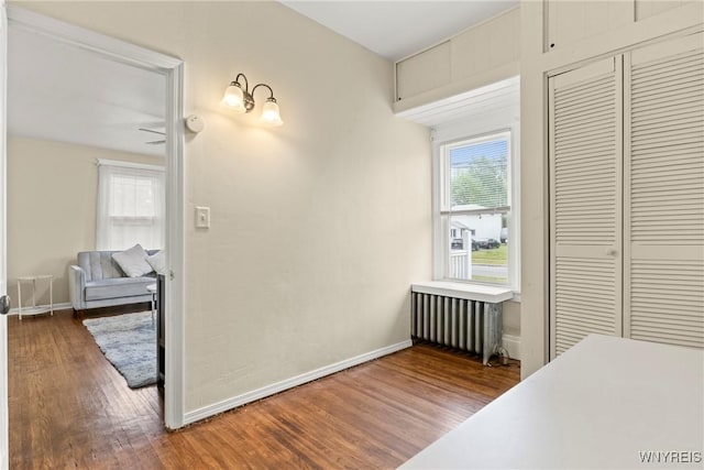 540 Longmeadow Rd, Amherst, NY 14226 - corridor with radiator heating unit and wood finished floors