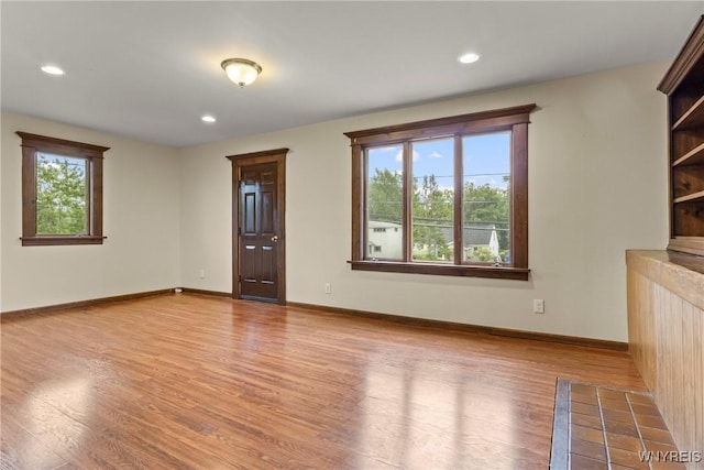 540 Longmeadow Rd, Amherst, NY 14226 - unfurnished living room featuring wood finished floors and recessed lighting
