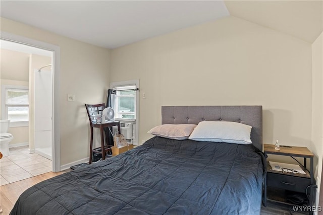 540 Longmeadow Rd, Amherst, NY 14226 - bedroom with multiple windows, lofted ceiling, wood finished floors, and connected bathroom