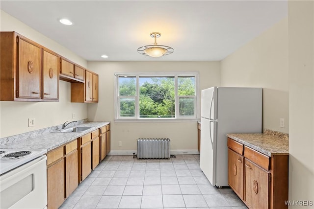 540 Longmeadow Rd, Amherst, NY 14226 - kitchen with white appliances, radiator heating unit, light countertops, recessed lighting, and light tile patterned floors