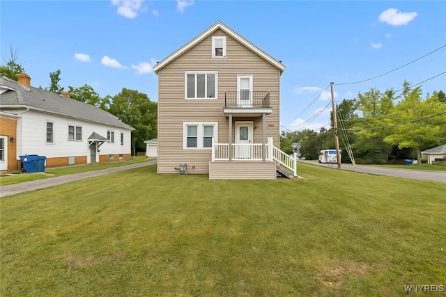 540 Longmeadow Rd, Amherst, NY 14226 - view of front of home with a front lawn and a balcony
