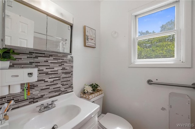 1142 Harlem Rd, Cheektowaga, NY 14227 - bathroom featuring tasteful backsplash, a shower with shower curtain, and vanity