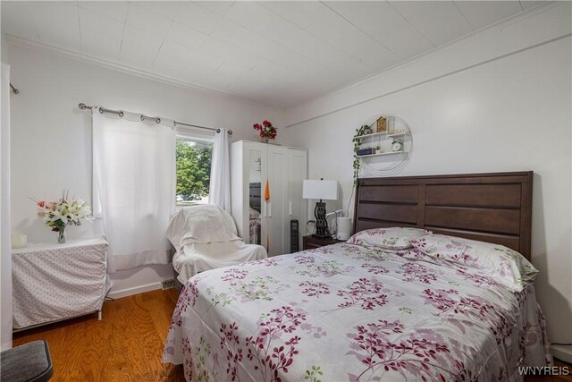 1142 Harlem Rd, Cheektowaga, NY 14227 - bedroom with wood finished floors and ornamental molding