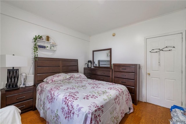 1142 Harlem Rd, Cheektowaga, NY 14227 - bedroom featuring light wood-style floors and crown molding