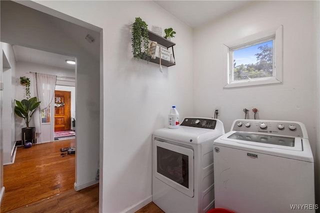 1142 Harlem Rd, Cheektowaga, NY 14227 - laundry area with washing machine and dryer and wood finished floors