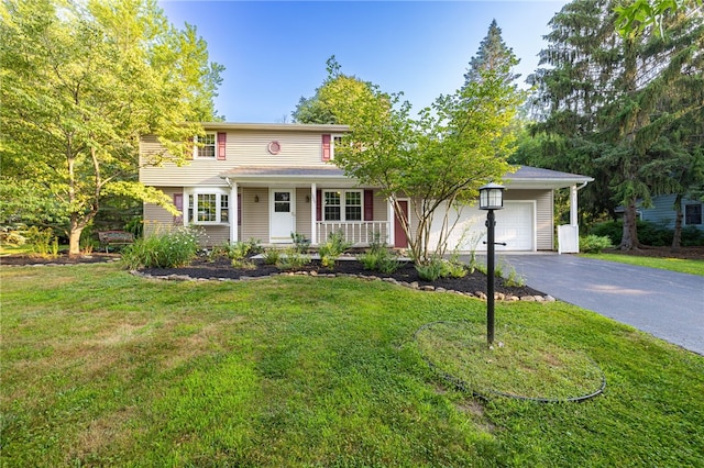 1225 Majestic Way, Webster, NY 14580 - view of front of property featuring a porch, driveway, a garage, and a front lawn