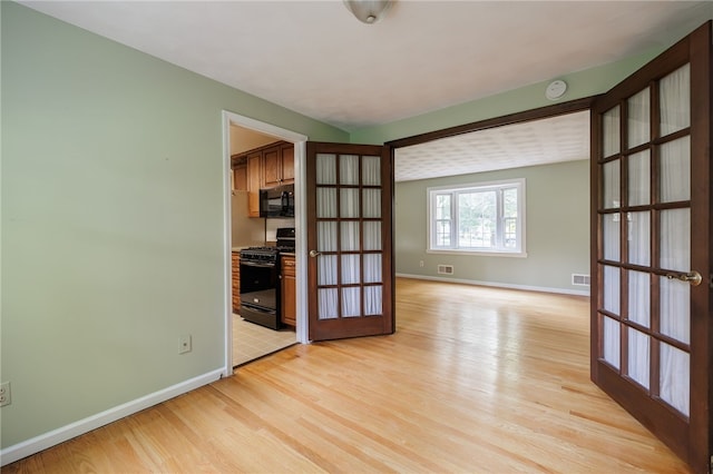 1225 Majestic Way, Webster, NY 14580 - unfurnished room with light wood-type flooring and french doors