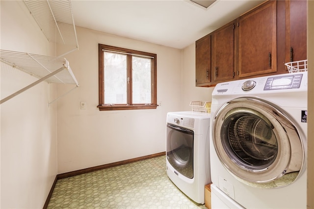 1225 Majestic Way, Webster, NY 14580 - laundry room featuring washing machine and clothes dryer, cabinet space, and light floors
