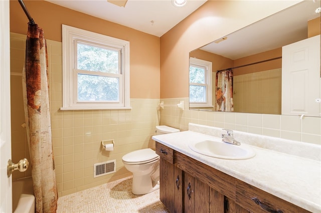 1225 Majestic Way, Webster, NY 14580 - bathroom with tile walls, vanity, plenty of natural light, tile patterned flooring, and a wainscoted wall