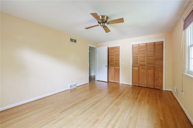 1225 Majestic Way, Webster, NY 14580 - unfurnished bedroom with two closets, light wood finished floors, and a ceiling fan