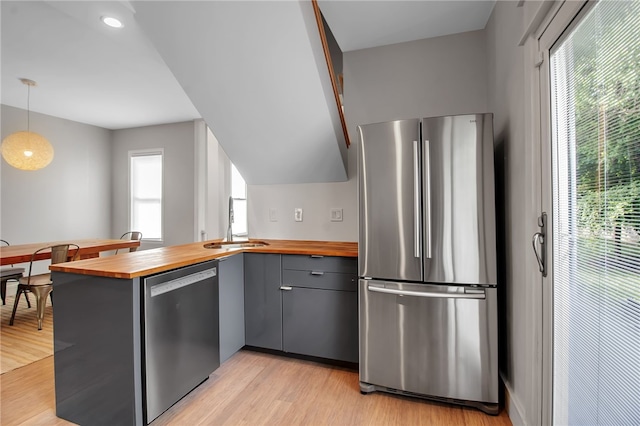 373 Rhode Island St, Buffalo, NY 14213 - kitchen featuring wood counters, appliances with stainless steel finishes, gray cabinetry, a peninsula, and light wood-style flooring
