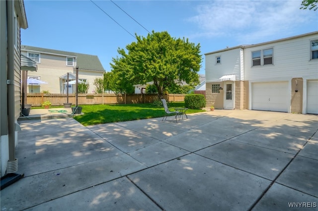 235 Wagner Ave, Cheektowaga, NY 14212 - view of patio / terrace with driveway and an attached garage