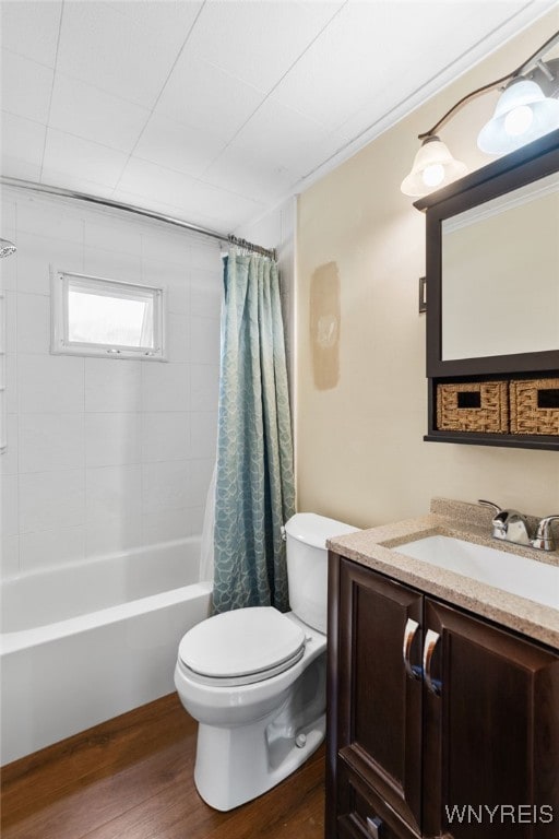 235 Wagner Ave, Cheektowaga, NY 14212 - bathroom featuring wood finished floors, vanity, and shower / bath combination with curtain