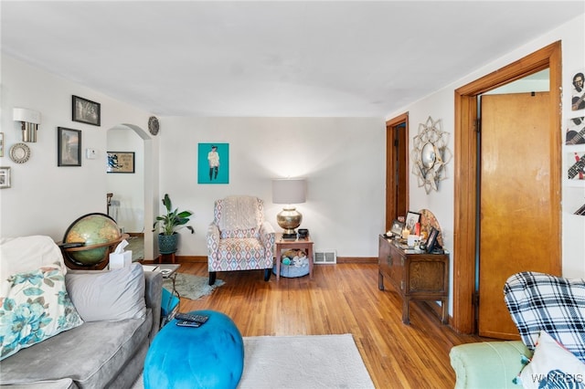 235 Wagner Ave, Cheektowaga, NY 14212 - living room featuring arched walkways and wood finished floors