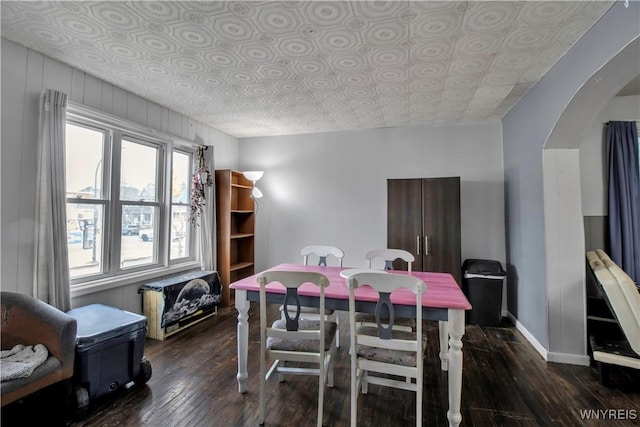 49 Massachusetts Ave, Buffalo, NY 14213 - dining space featuring an ornate ceiling, hardwood / wood-style floors, and arched walkways