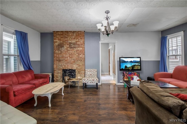 49 Massachusetts Ave, Buffalo, NY 14213 - living area featuring a chandelier, wood finished floors, and a fireplace