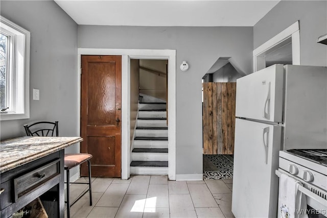 49 Massachusetts Ave, Buffalo, NY 14213 - kitchen with white appliances, light tile patterned floors, and light countertops