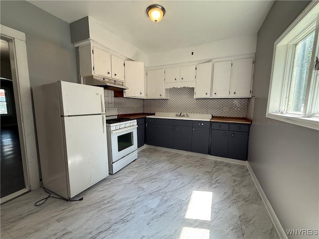 49 Massachusetts Ave, Buffalo, NY 14213 - kitchen with white appliances, decorative backsplash, light marble finish floors, and under cabinet range hood