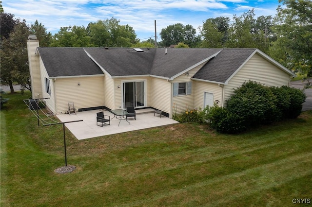 42 Park Ter, Sherrill, NY 13461 - rear view of house featuring a patio area, a lawn, and roof with shingles