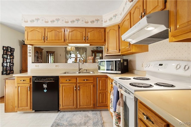42 Park Ter, Sherrill, NY 13461 - kitchen with white electric range, under cabinet range hood, light countertops, and wallpapered walls