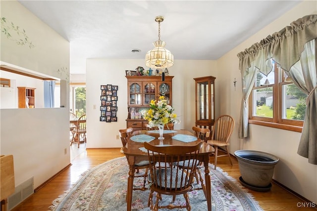 42 Park Ter, Sherrill, NY 13461 - dining room featuring light wood-style flooring and a chandelier
