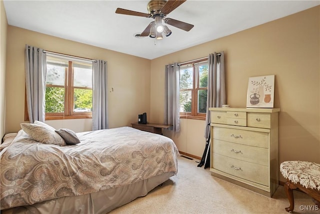 42 Park Ter, Sherrill, NY 13461 - bedroom with light colored carpet and a ceiling fan