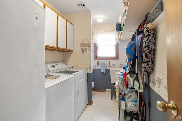 42 Park Ter, Sherrill, NY 13461 - washroom with washer and clothes dryer and cabinet space