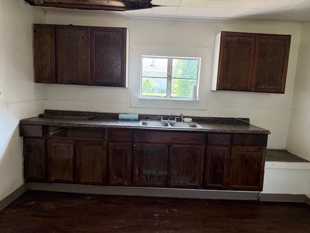 127 Conkey Ave, Rochester, NY 14621 - kitchen featuring dark countertops, dark brown cabinetry, and dark wood-style floors